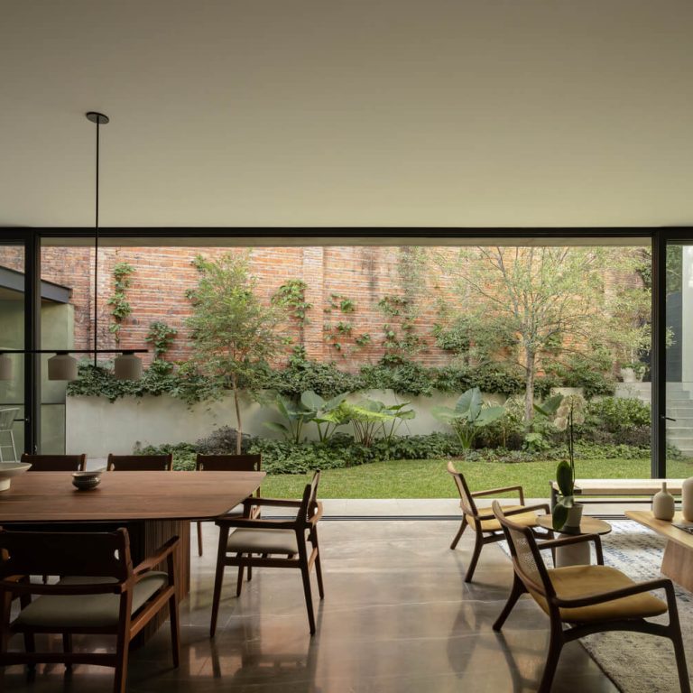 Casa DLCA por 0studio Arquitectura: Integración Paisajística y Diseño